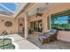 Relaxing covered patio with comfortable seating area, ceiling fans, and clear views of the pool at 7624 Boltons Ct, Bradenton, FL 34201