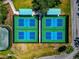 Aerial view of community pickleball courts with striped canopies providing shade at 7624 Boltons Ct, Bradenton, FL 34201