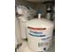 Undersink view of a water filtration system, ensuring quality water throughout the residence at 7624 Boltons Ct, Bradenton, FL 34201