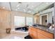 Well-lit bathroom featuring a glass shower, standalone tub, and updated countertops at 8142 Misty Oaks Blvd, Sarasota, FL 34243