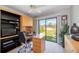 Bright office space with built-in shelving and drawers plus a relaxing outdoor view at 8142 Misty Oaks Blvd, Sarasota, FL 34243