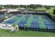 Aerial view of Palm Aire Country Club pickleball courts, showcasing active play and a vibrant community atmosphere at 8142 Misty Oaks Blvd, Sarasota, FL 34243