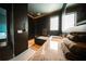 Contemporary bathroom showcasing dark tile, a soaking tub and marble countertops at 816 Goodrich Ave, Sarasota, FL 34236