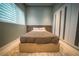 Contemporary bedroom with large window, sleek built-in wardrobe, and neutral décor at 816 Goodrich Ave, Sarasota, FL 34236
