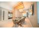 Elegant dining room with a glass top table, modern chandelier, and stylish decor, perfect for entertaining at 816 Goodrich Ave, Sarasota, FL 34236