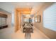 Bright dining room boasts a modern chandelier, glass dining table, and an open-concept layout at 816 Goodrich Ave, Sarasota, FL 34236