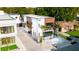 Modern home's exterior featuring clean lines, wood accents, a well-maintained yard, and an inviting facade at 816 Goodrich Ave, Sarasota, FL 34236