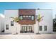 Stunning modern home featuring a minimalist design with a private outdoor seating area and palm tree landscaping at 816 Goodrich Ave, Sarasota, FL 34236