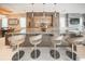 Open concept kitchen featuring an expansive marble island, modern bar stools, and sleek cabinetry at 816 Goodrich Ave, Sarasota, FL 34236