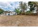 Expansive backyard featuring a gazebo and the rear view of the home with freshly installed AC at 1016 38Th W St, Bradenton, FL 34205