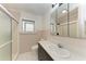Bathroom with a shower, toilet, and vanity mirror at 1016 38Th W St, Bradenton, FL 34205