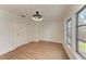 Bright bedroom with hardwood floors, a modern ceiling fan, and natural light at 1016 38Th W St, Bradenton, FL 34205
