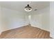Bedroom featuring hardwood floors, crisp white walls, and bright natural light at 1016 38Th W St, Bradenton, FL 34205