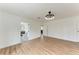 Light bedroom with recessed lighting, a door to the bathroom, and wood-look floors at 1016 38Th W St, Bradenton, FL 34205