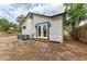 Exterior view of the home featuring a newly installed AC, double doors and fresh paint at 1016 38Th W St, Bradenton, FL 34205
