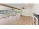 Sunroom with white shiplap, wood floors, and modern lighting, creating an inviting and naturally lit living area at 1016 38Th W St, Bradenton, FL 34205