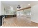 Bright living room features recessed lighting, wooden ceiling beams, and a modern fireplace at 1016 38Th W St, Bradenton, FL 34205