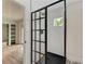 A view of the shower with subway tile, a dark showerhead, and a black frame glass shower door at 1016 38Th W St, Bradenton, FL 34205