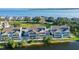 Waterfront home featuring a screened porch and lush landscaping at 111 Tidy Island Blvd # 111, Bradenton, FL 34210