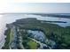 Breathtaking aerial view of waterfront homes, lush greenery, and tranquil waters, creating an idyllic and serene coastal living experience at 111 Tidy Island Blvd # 111, Bradenton, FL 34210