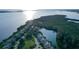 Stunning aerial view of coastal homes nestled along the waterfront, surrounded by lush greenery and serene waters, creating a peaceful setting at 111 Tidy Island Blvd # 111, Bradenton, FL 34210