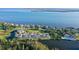 Waterfront home with lush landscaping surrounded by beautiful blue water at 111 Tidy Island Blvd # 111, Bradenton, FL 34210
