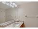Bathroom with a large mirror, vanity, and modern fixtures at 111 Tidy Island Blvd # 111, Bradenton, FL 34210