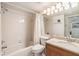 Bathroom featuring a tub/shower combination, toilet and wood vanity with sink at 111 Tidy Island Blvd # 111, Bradenton, FL 34210