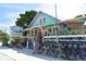 Vibrant Beach Bums storefront with colorful bicycles and surfboards, offering rentals and beach supplies at 111 Tidy Island Blvd # 111, Bradenton, FL 34210