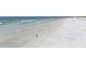 Expansive white sand beach with gentle waves, ideal for swimming and relaxation at 111 Tidy Island Blvd # 111, Bradenton, FL 34210