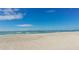 Expansive beachfront with clear blue skies and calm ocean waters, perfect for relaxation and recreation at 111 Tidy Island Blvd # 111, Bradenton, FL 34210