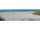 Scenic beach featuring white sand, rolling waves, and clear blue skies at 111 Tidy Island Blvd # 111, Bradenton, FL 34210