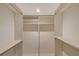Walk-in closet with shelves and rods for hanging clothes, offering ample storage space at 111 Tidy Island Blvd # 111, Bradenton, FL 34210