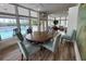 Light filled clubhouse features water view and round table with seating for card and board games at 111 Tidy Island Blvd # 111, Bradenton, FL 34210