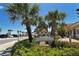 Entrance to Bayview Plaza with lush greenery and a sign with the address and name at 111 Tidy Island Blvd # 111, Bradenton, FL 34210