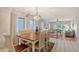 Light and airy dining room with tile floors and an elegant chandelier at 111 Tidy Island Blvd # 111, Bradenton, FL 34210