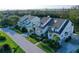 Street view of townhomes with mature landscaping at 111 Tidy Island Blvd # 111, Bradenton, FL 34210
