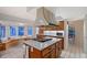 Well-appointed kitchen with a center island, custom cabinetry, and a breakfast nook, ideal for casual dining and entertaining at 111 Tidy Island Blvd # 111, Bradenton, FL 34210