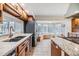 Charming kitchen with wood cabinets, breakfast nook, and stainless steel refrigerator; bright and inviting at 111 Tidy Island Blvd # 111, Bradenton, FL 34210