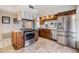 Well-maintained kitchen featuring stainless steel appliances, wood cabinets, and ample counter space at 111 Tidy Island Blvd # 111, Bradenton, FL 34210