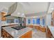 Open kitchen with island cooktop and a cozy breakfast nook at 111 Tidy Island Blvd # 111, Bradenton, FL 34210