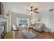 Bright living room featuring a fireplace, plush seating, and sliding glass doors to a private balcony for indoor-outdoor enjoyment at 111 Tidy Island Blvd # 111, Bradenton, FL 34210