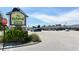 Exterior view of the Island Shopping Center with ample parking and lush landscaping at 111 Tidy Island Blvd # 111, Bradenton, FL 34210