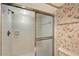 Clean and bright shower with white tiles and sliding glass door at 111 Tidy Island Blvd # 111, Bradenton, FL 34210