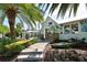 Charming storefront with kayaks displayed, nestled among tropical foliage and palm trees at 111 Tidy Island Blvd # 111, Bradenton, FL 34210