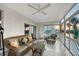 Bright and airy sunroom features comfortable wicker furniture, offering serene water views and a relaxing atmosphere at 111 Tidy Island Blvd # 111, Bradenton, FL 34210