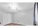 This bedroom features wood flooring, gray walls, closet, and a window at 1143 131St E St, Bradenton, FL 34212