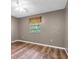 This bedroom features wood flooring and a window at 1143 131St E St, Bradenton, FL 34212