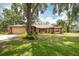Charming single-story home with a well-manicured lawn and mature trees offering ample shade at 1143 131St E St, Bradenton, FL 34212