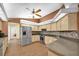 Bright kitchen with wood cabinets, stainless steel appliances, and ample counter space at 1143 131St E St, Bradenton, FL 34212